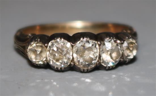 A 19th century gold and silver, graduated five stone old mine cut diamond half hoop ring, size I.